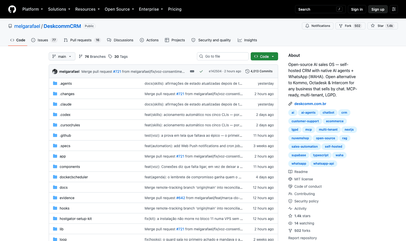 The DeskcommCRM repository on GitHub, showing the MIT licence, the stack badges and the release cadence through v1.19.0